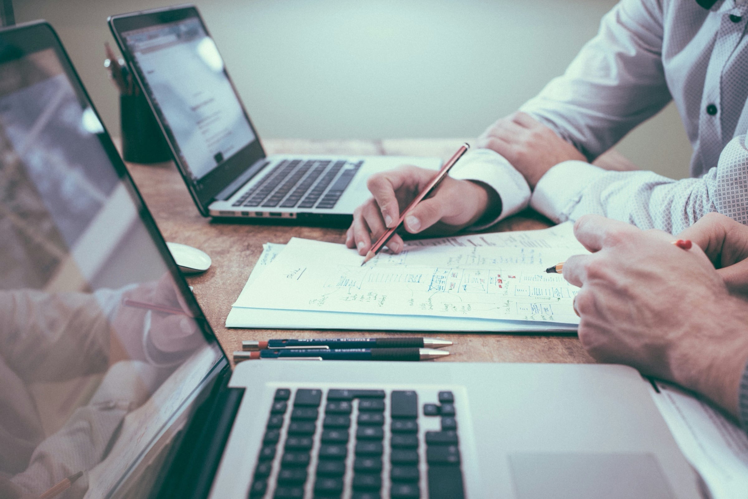 Two people working on a plan