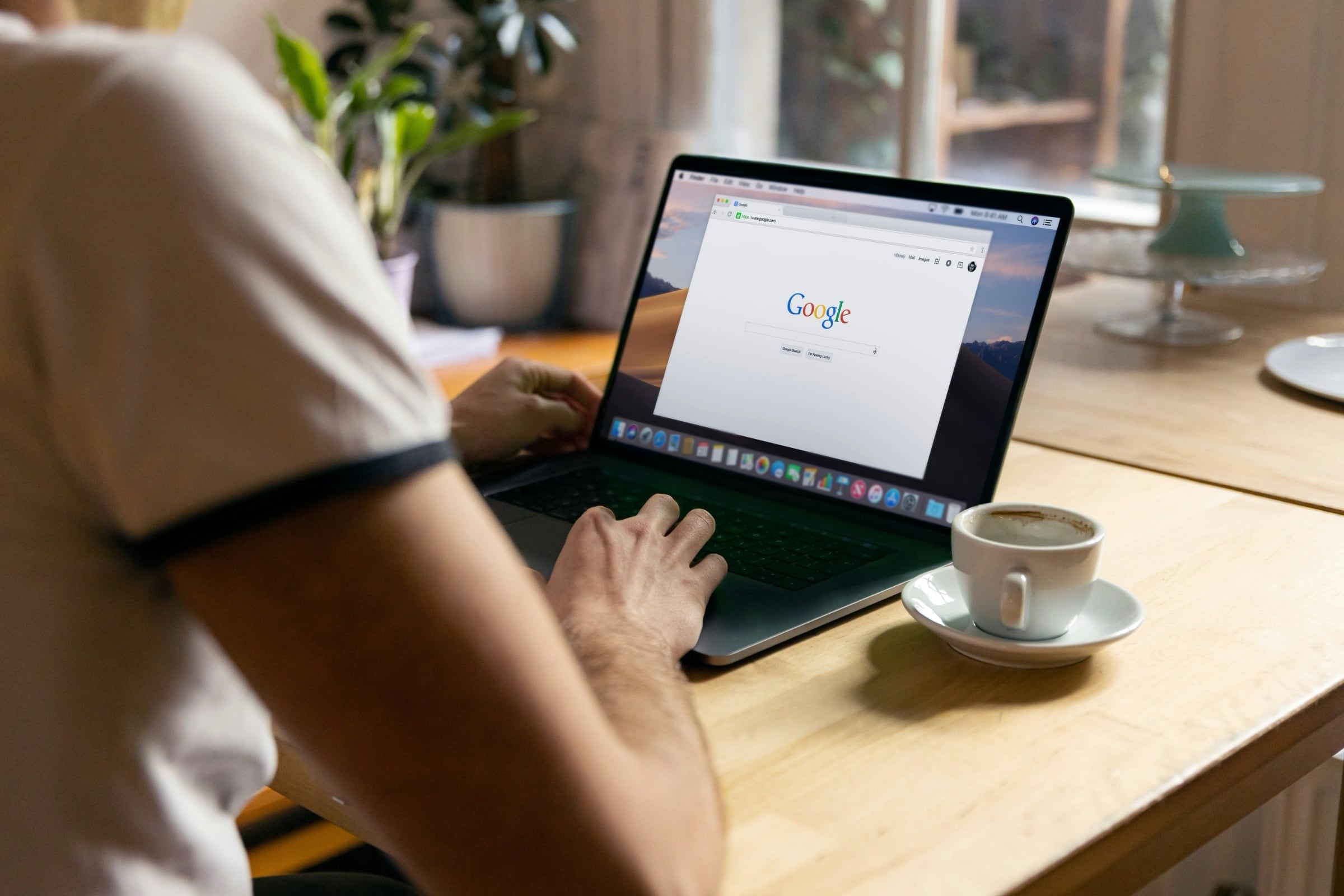 Person sitting at a desk about to search for a web resource
