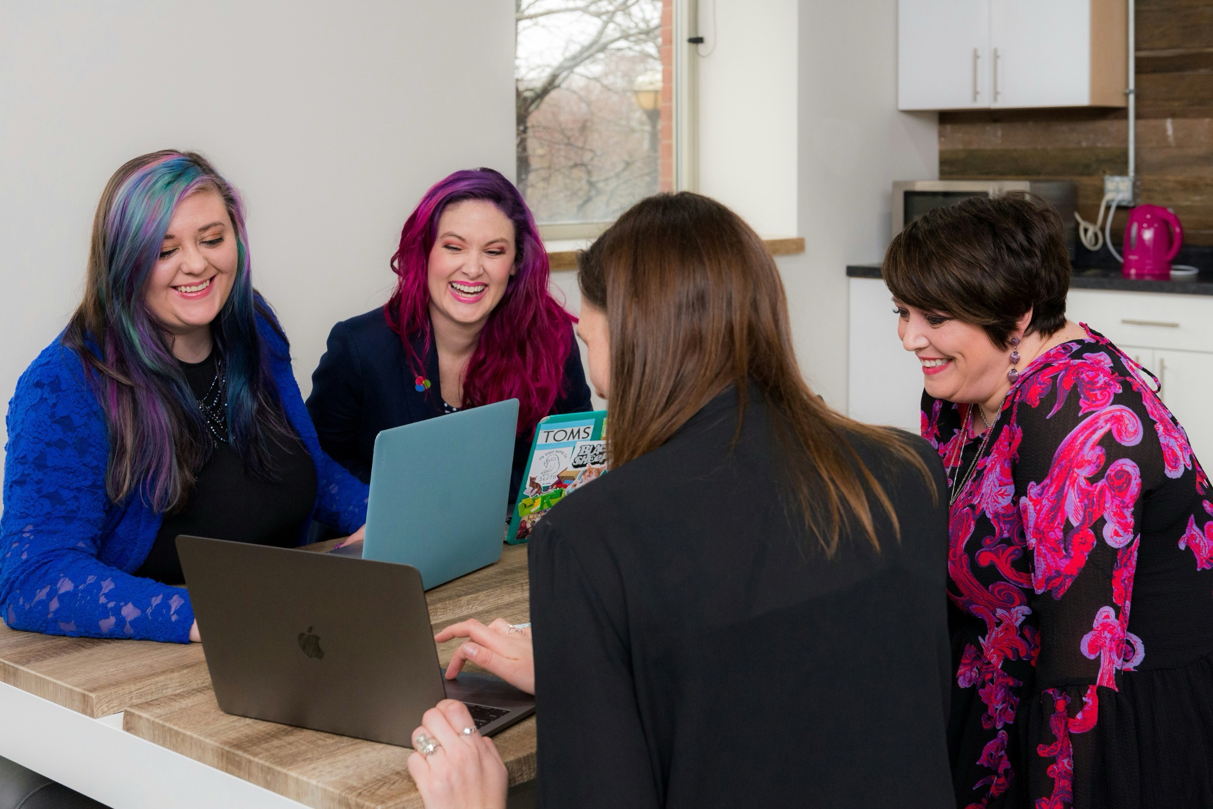 A group of people around a desk